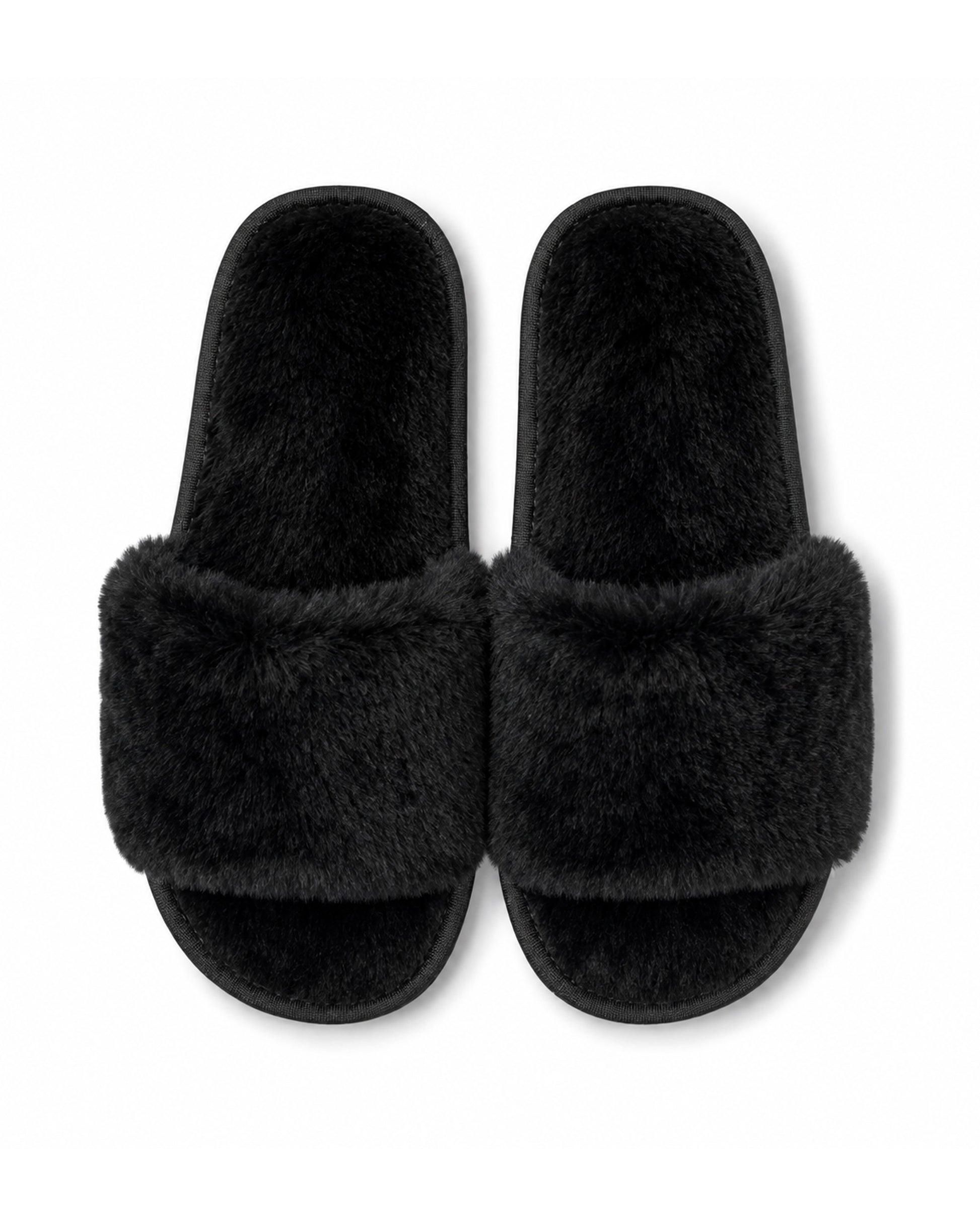 Black wholesale slippers in bulk with non-slip soles. 