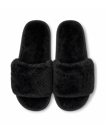 Black wholesale slippers in bulk with non-slip soles. 