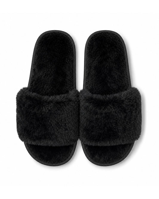 Black wholesale slippers in bulk with non-slip soles. 